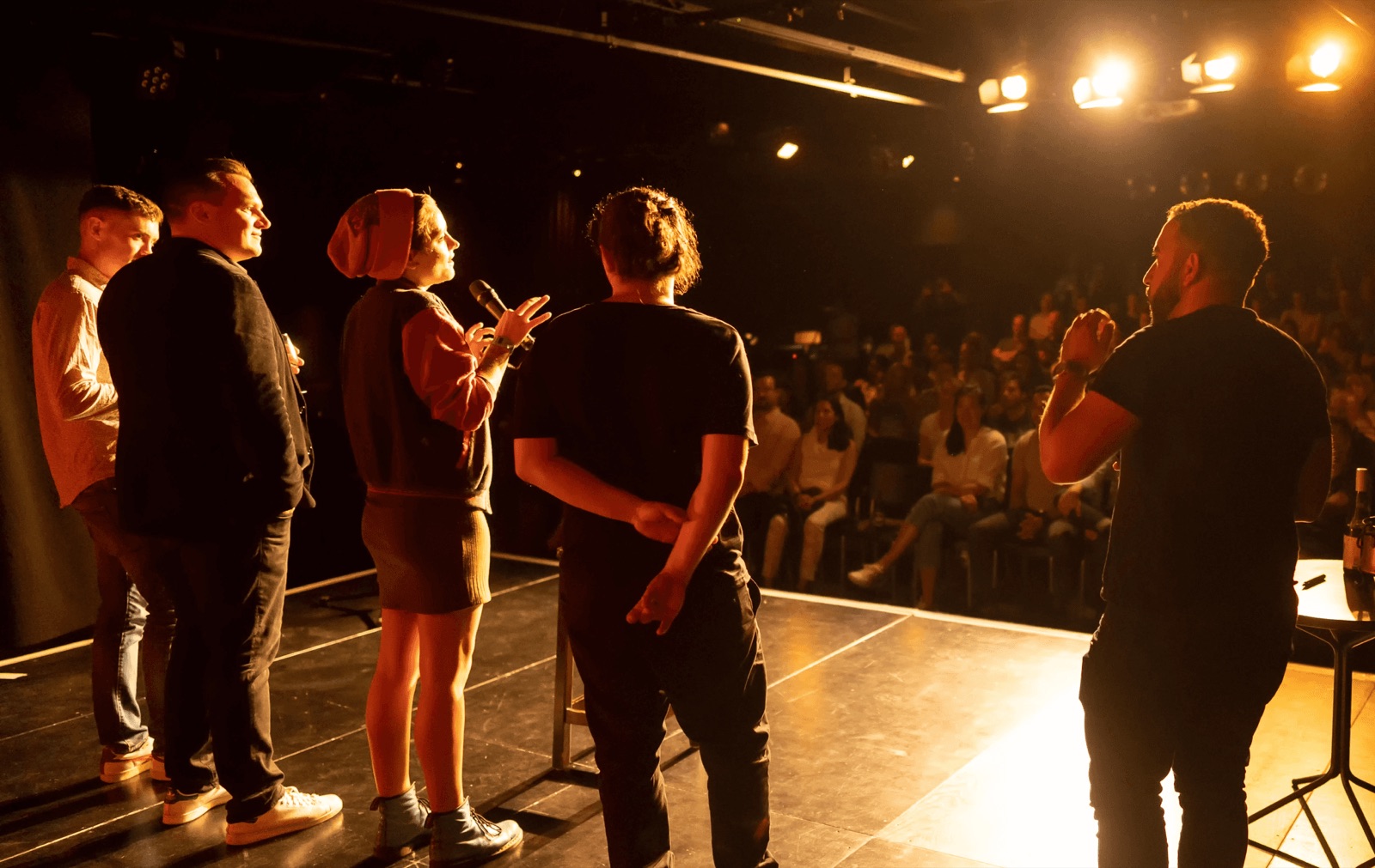 Workshop participants on stage, coached by Benjamin